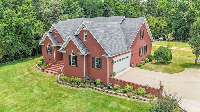 view of front facade with a front yard and a garage