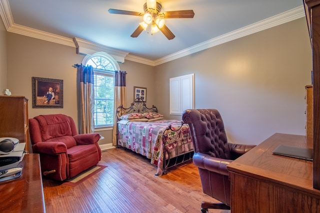 bedroom with ceiling fan, crown molding, and light wood-type flooring