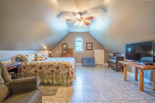 bedroom featuring ceiling fan, light tile patterned flooring, and lofted ceiling