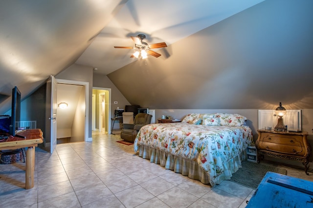 tiled bedroom with ceiling fan and vaulted ceiling