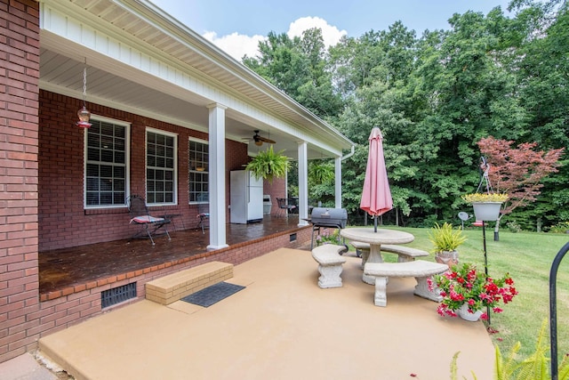 view of patio / terrace with ceiling fan and area for grilling