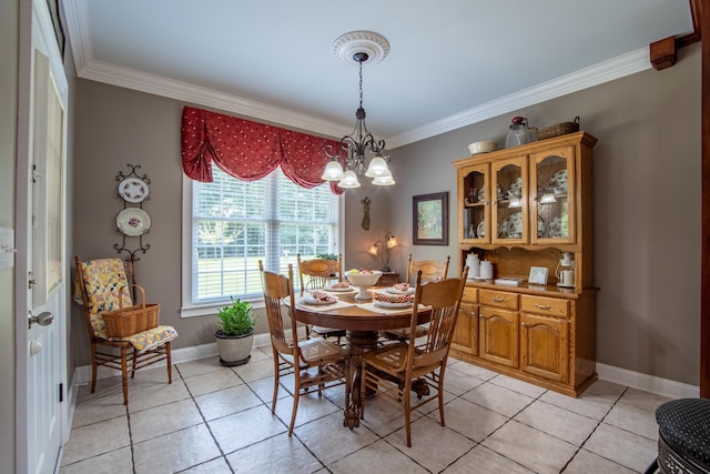 dining room featuring light tile patterned floors, crown molding, and a notable chandelier