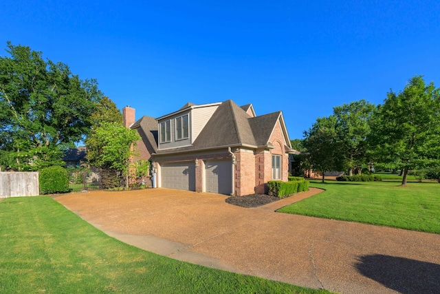 view of home's exterior featuring a garage and a yard