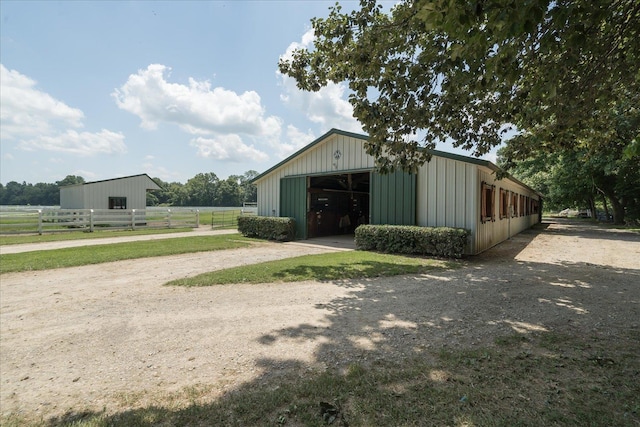 view of outdoor structure with a rural view