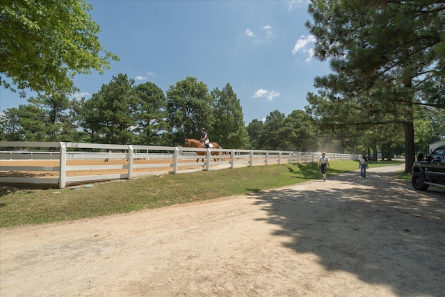 view of yard with a rural view