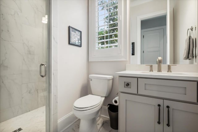 bathroom with a shower with shower door, toilet, and vanity