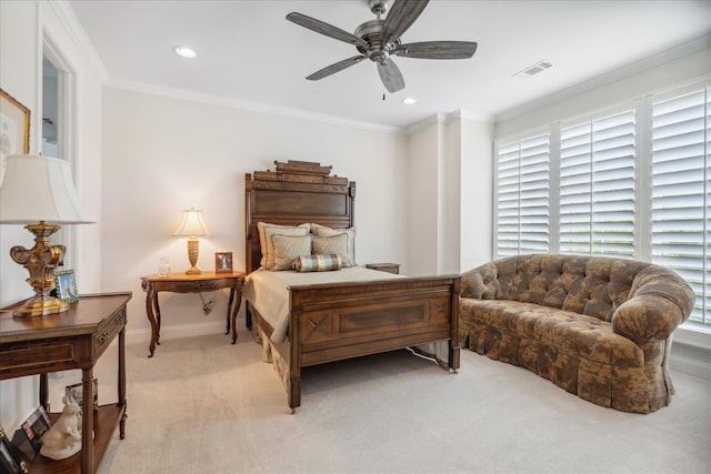 bedroom with light carpet, ceiling fan, and crown molding