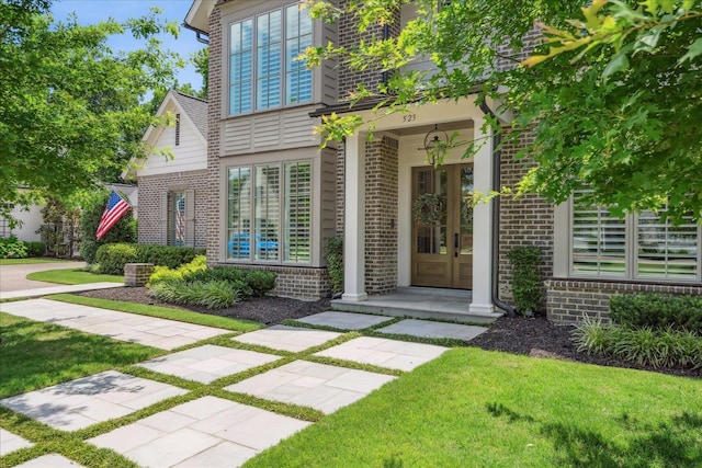 entrance to property with a yard