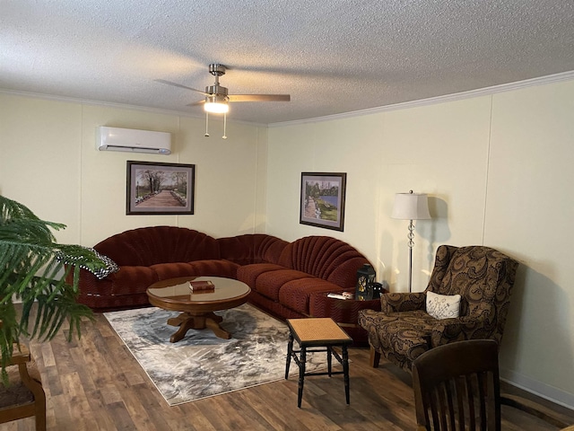 living room featuring an AC wall unit, crown molding, dark hardwood / wood-style floors, and a textured ceiling