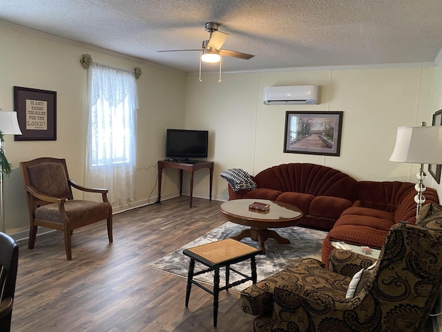 living room with ceiling fan, ornamental molding, dark wood-type flooring, and a wall unit AC