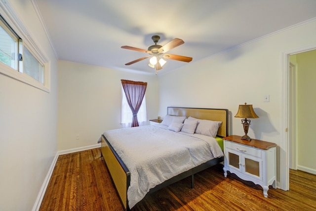 bedroom with baseboards, ceiling fan, dark wood-style flooring, and crown molding