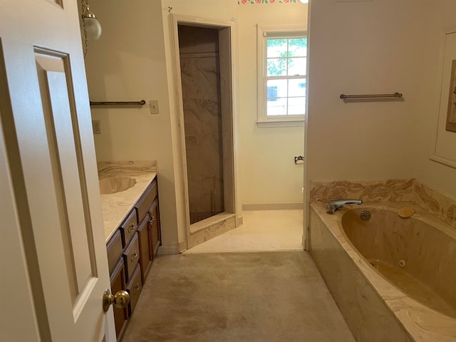 bathroom featuring shower with separate bathtub and vanity