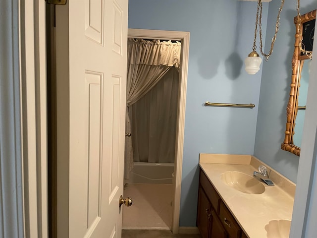 bathroom featuring shower / tub combo with curtain and oversized vanity