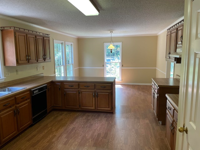 kitchen featuring dark wood-type flooring, plenty of natural light, kitchen peninsula, and black dishwasher