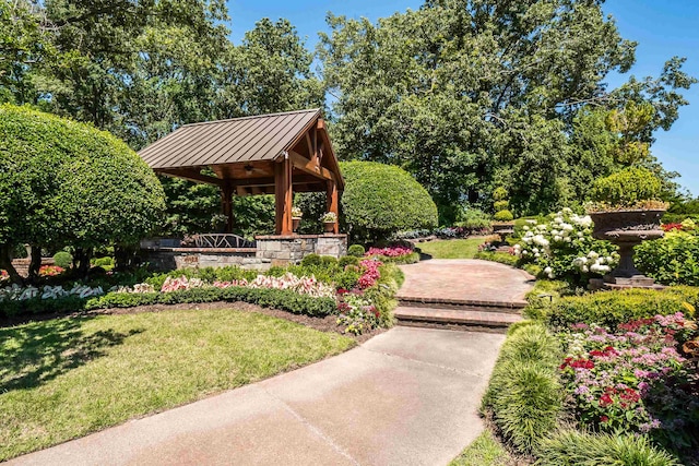 surrounding community with a yard and a gazebo