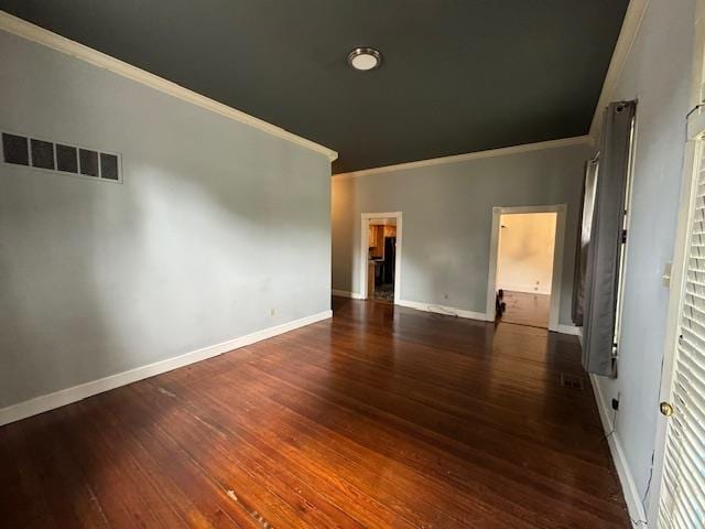 unfurnished room featuring ornamental molding and dark hardwood / wood-style floors