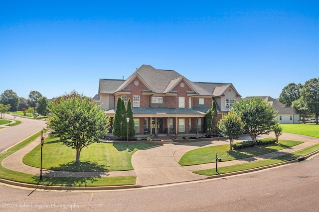 craftsman inspired home featuring a front yard and a porch