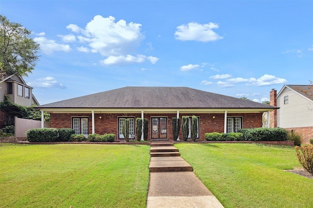 ranch-style home featuring a front lawn