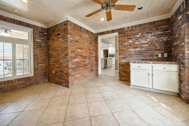 tiled spare room featuring ornamental molding, brick wall, and wooden ceiling