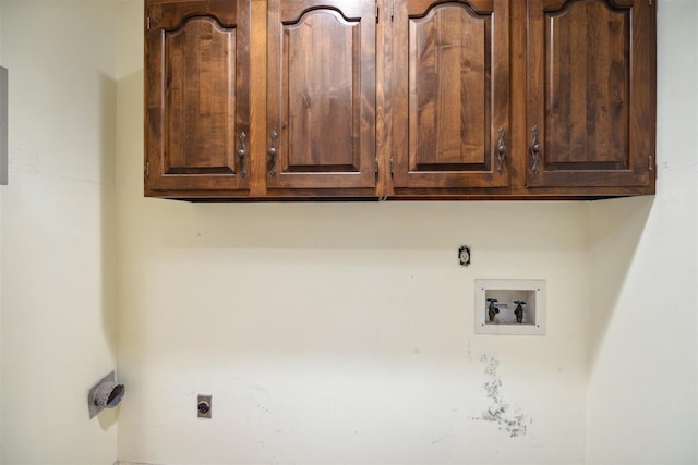 washroom with cabinets, hookup for a washing machine, and electric dryer hookup