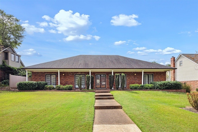 ranch-style house featuring a front yard