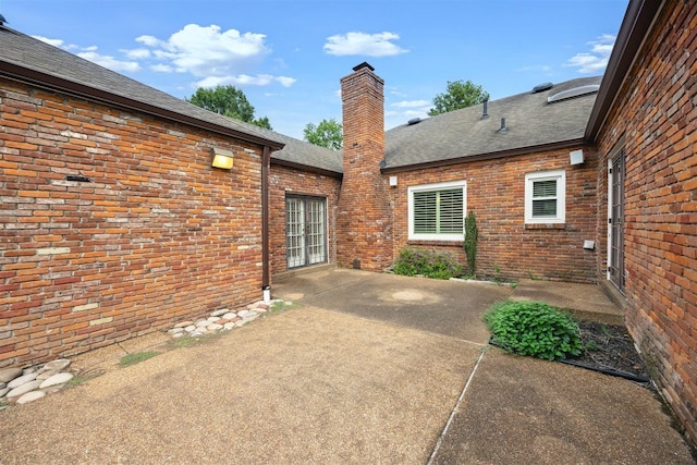 back of property with a patio