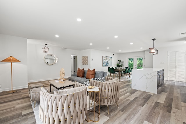 living room featuring french doors and hardwood / wood-style flooring