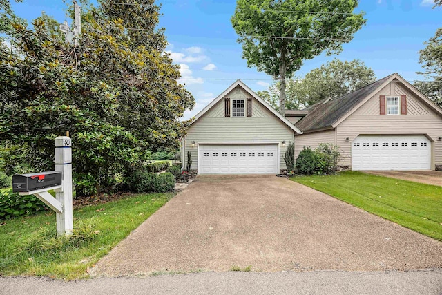 view of front facade with a garage and a front lawn