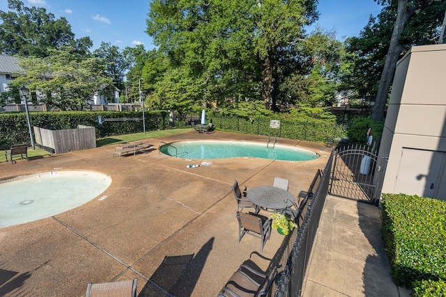 view of swimming pool featuring a patio area