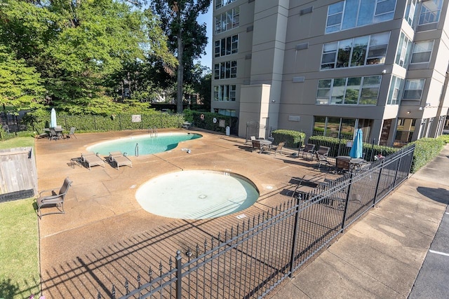 view of swimming pool featuring a patio area