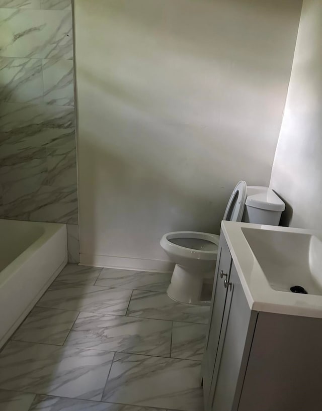 bathroom with tile patterned floors, vanity, and toilet