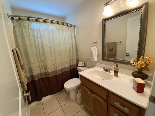 bathroom featuring tile patterned floors, curtained shower, vanity, and toilet