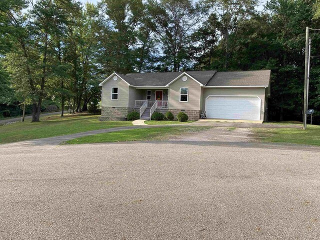 view of front of home with a garage and a front yard