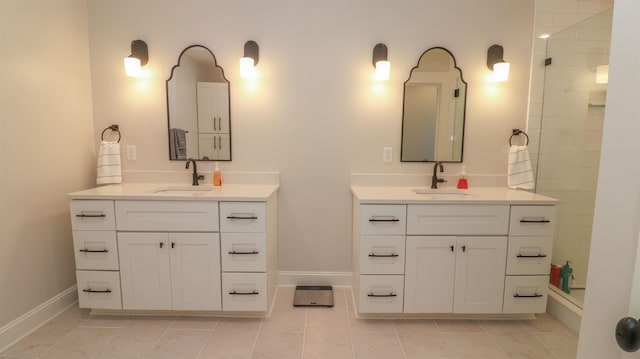 bathroom featuring vanity and a shower with shower door