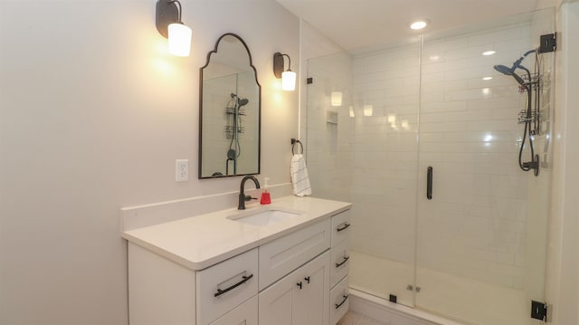 bathroom with vanity and an enclosed shower