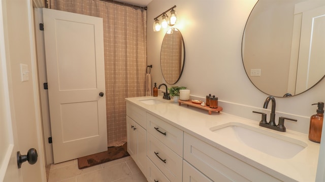 bathroom featuring tile patterned floors and dual bowl vanity