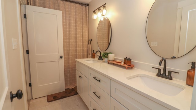 bathroom with tile patterned flooring and vanity