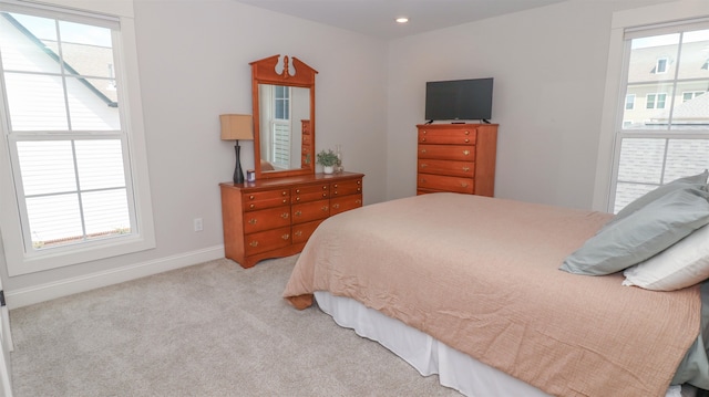 bedroom with light colored carpet