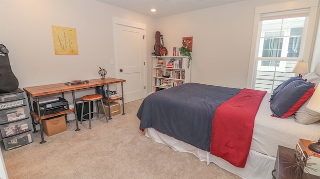 bedroom featuring light colored carpet