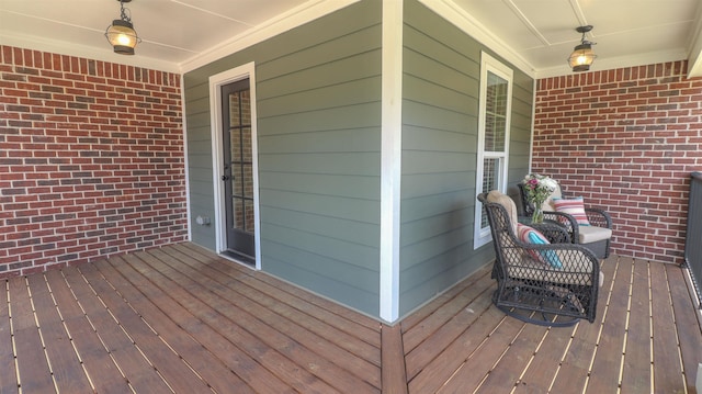 wooden deck featuring ceiling fan and a porch