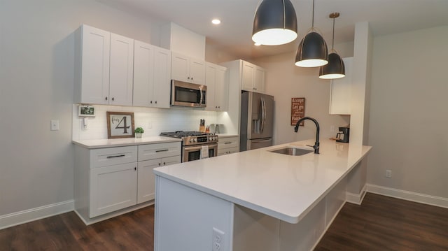 kitchen featuring sink, decorative backsplash, dark hardwood / wood-style floors, and stainless steel appliances