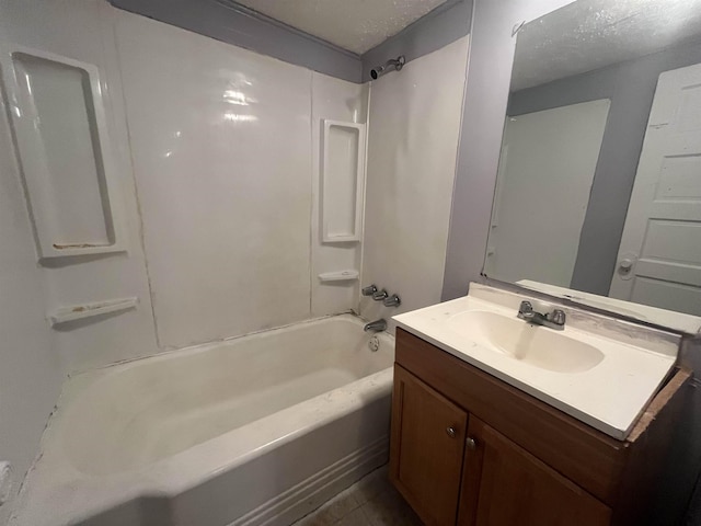 full bathroom featuring vanity, a textured ceiling, and shower / bathtub combination