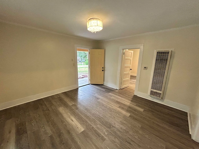 unfurnished bedroom featuring access to outside, crown molding, and dark wood-type flooring