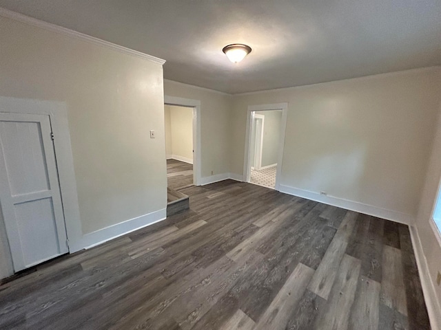 empty room with dark hardwood / wood-style flooring