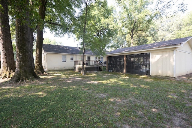 view of yard with an outbuilding and a deck