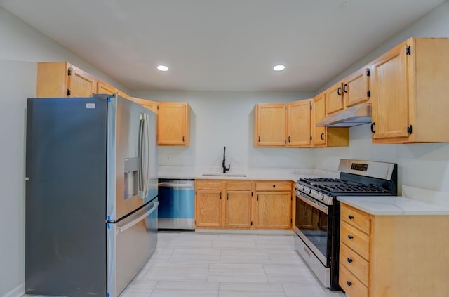 kitchen with light brown cabinetry, sink, and appliances with stainless steel finishes