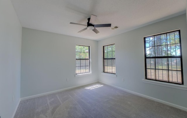 empty room with carpet and ceiling fan