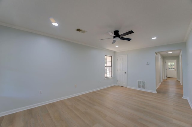 unfurnished room with ceiling fan, plenty of natural light, crown molding, and light hardwood / wood-style flooring