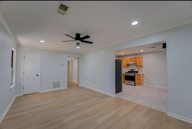 unfurnished living room with ceiling fan, ornamental molding, and light hardwood / wood-style floors