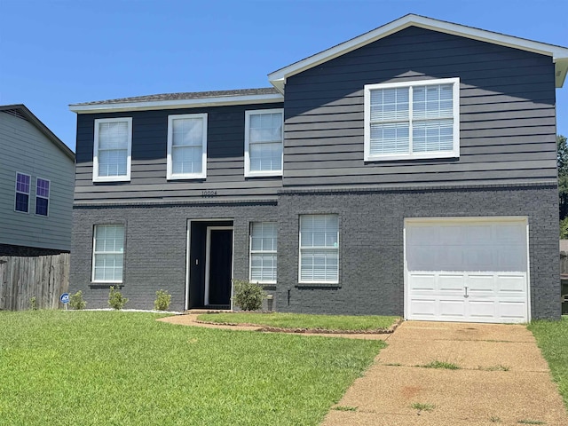 front of property featuring a garage and a front yard